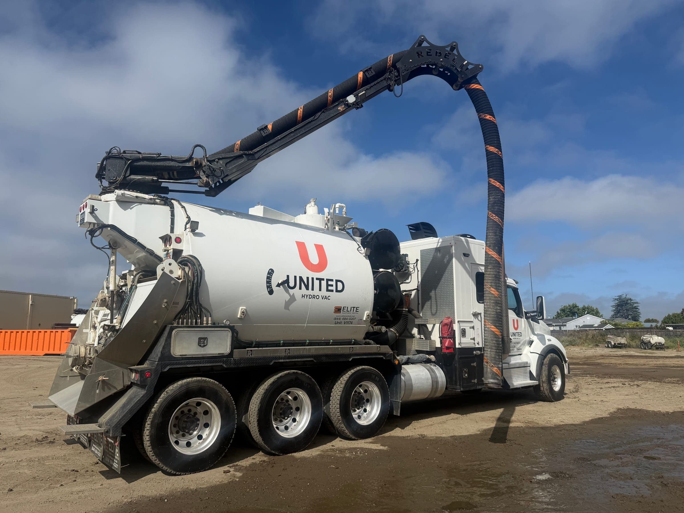 United Hydrovac crew running an extended-reach hose on site